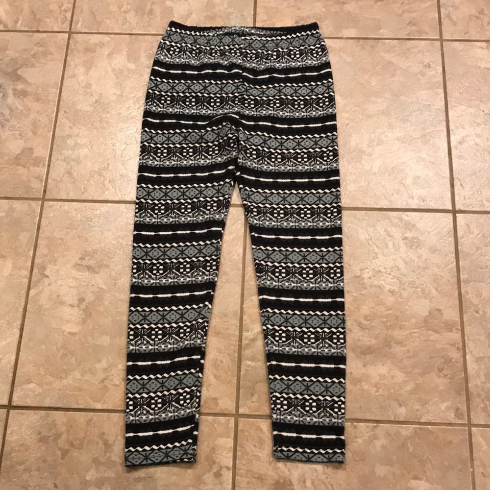 Black, white, and gray patterned fleece leggings